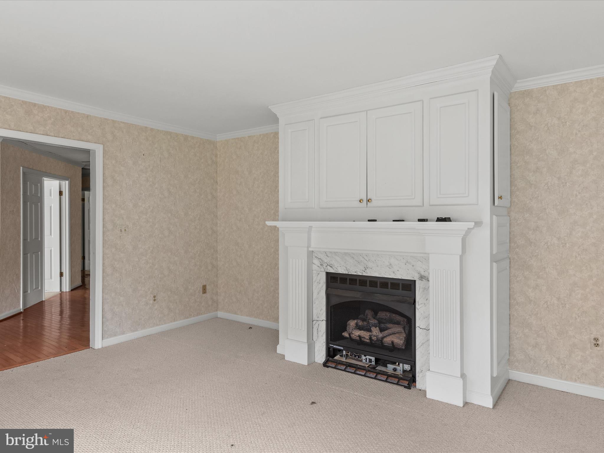 935 Susquehanna Road Madison, MD 21648 - Photo 13 of 42 a view of an empty room with a fireplace