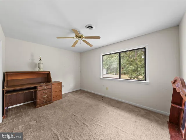 a view of workspace with furniture and windows