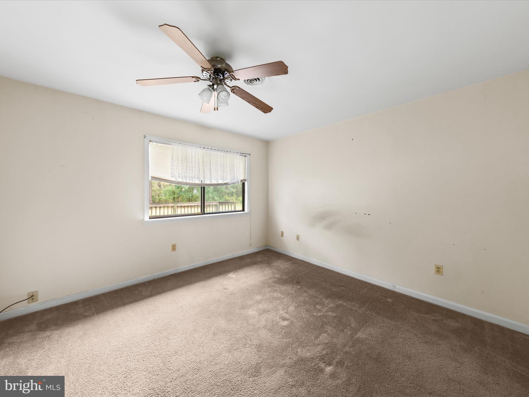 935 Susquehanna Road Madison, MD 21648 - Photo 22 of 42 an empty room with windows and fan