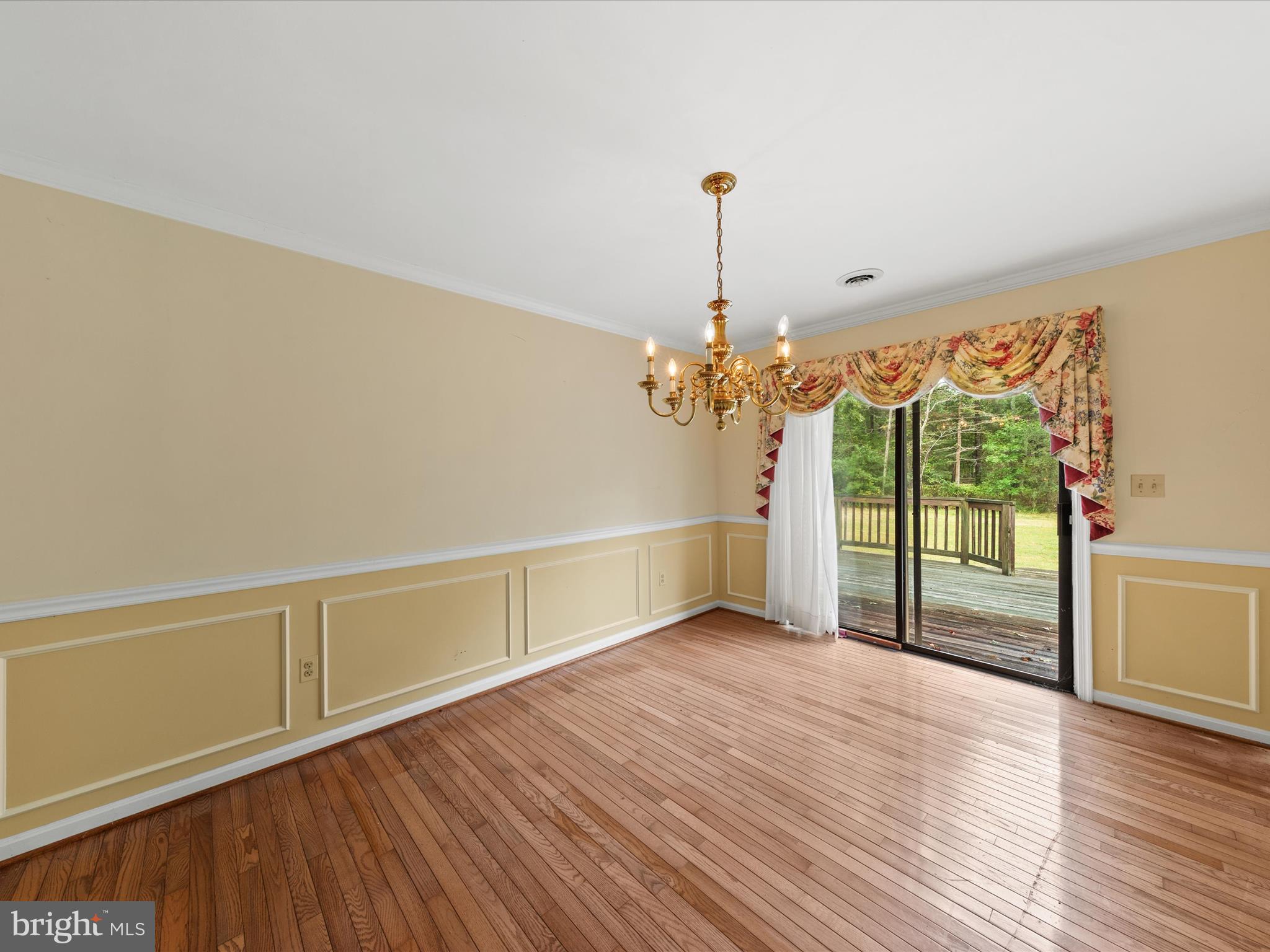 935 Susquehanna Road Madison, MD 21648 - Photo 26 of 42 a view of a livingroom with wooden floor and a chandelier