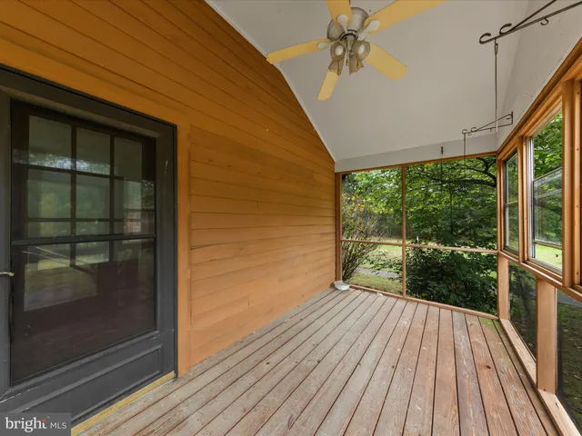 a view of balcony with wooden floor
