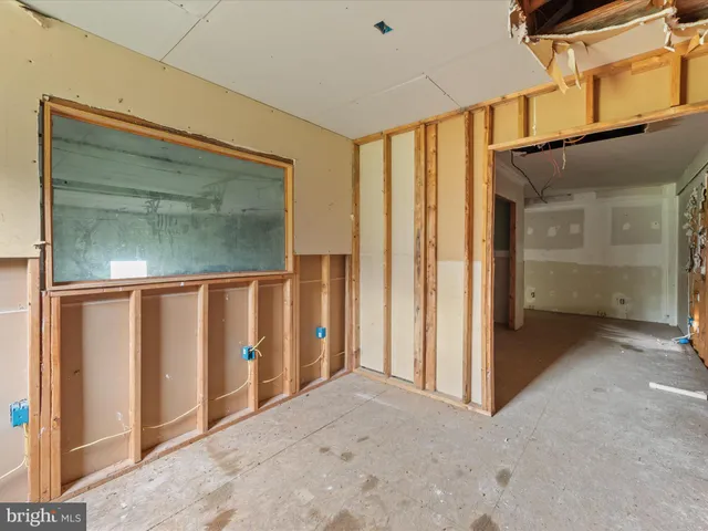 an empty room with a mirror