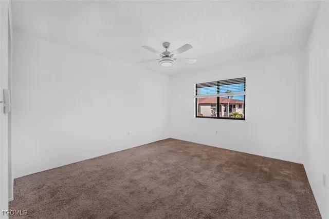 an empty room with fan