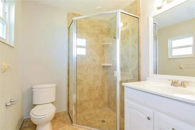 a bathroom with a shower and a toilet