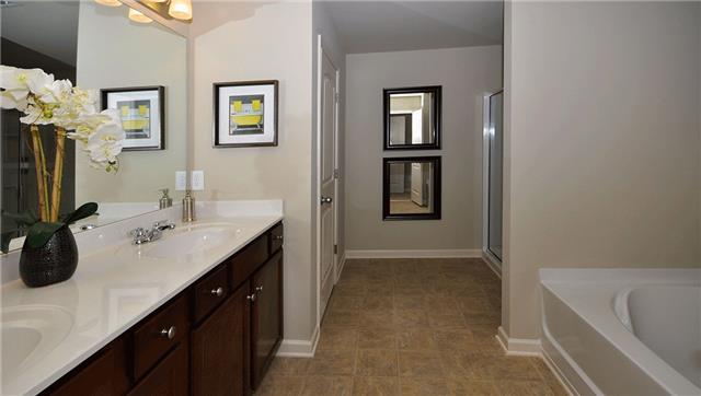 3937 Cannonsgate Lane Murfreesboro, TN 37128 - Photo 7 of 8 a bathroom with a tub sink and mirror