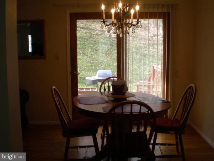 8600 Snowden Loop Laurel, MD 20708 - Photo 9 of 14 Dining room with view of rear deck and backyard