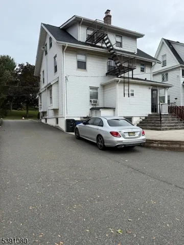 a car parked in front of a house