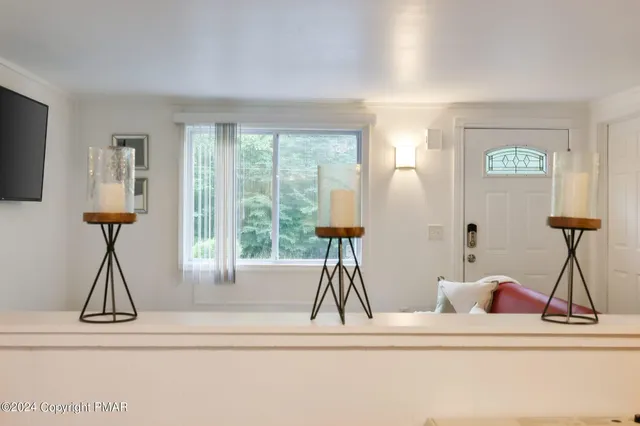 a view of living room with furniture and a window