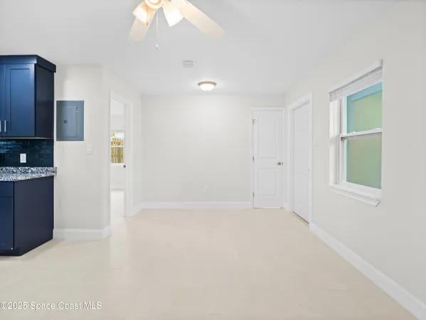 a view of an empty room with a window