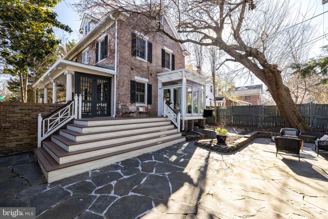 a bathroom with a tub a sink and a shower