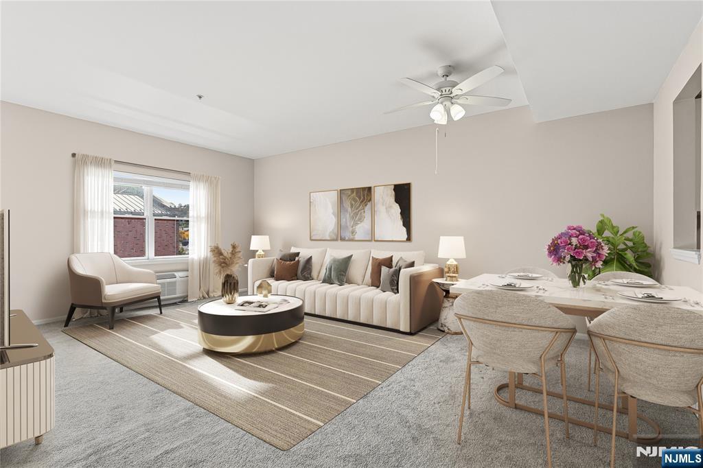 905 River Road, Unit 218 Edgewater, NJ 07020 - Photo 12 of 23 a living room with furniture and a large window