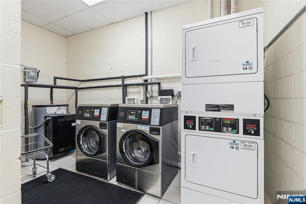 905 River Road, Unit 218 Edgewater, NJ 07020 - Photo 22 of 23 a utility room with dryer and washer