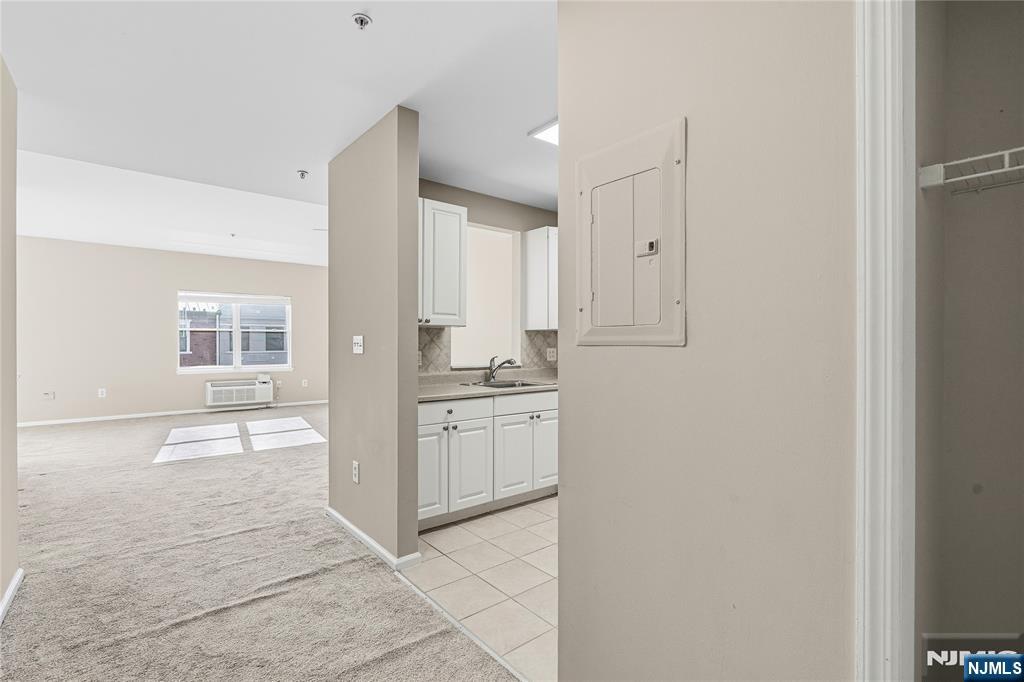 905 River Road, Unit 218 Edgewater, NJ 07020 - Photo 3 of 23 a bathroom with a sink and a mirror