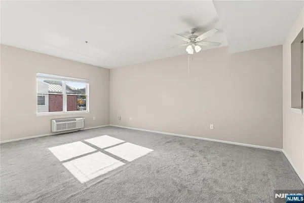 a view of an empty room with a window