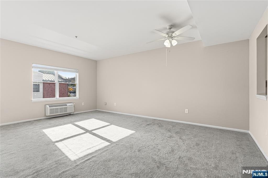 905 River Road, Unit 218 Edgewater, NJ 07020 - Photo 5 of 23 a view of an empty room with a window