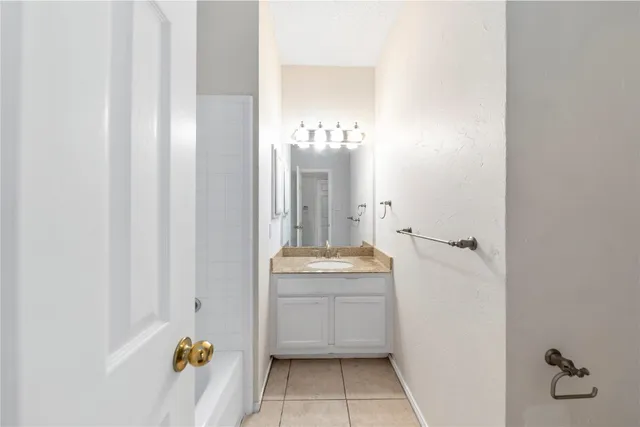 a bathroom with a sink and mirror