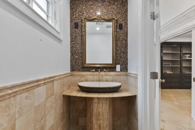 a bathroom with a sink and a mirror