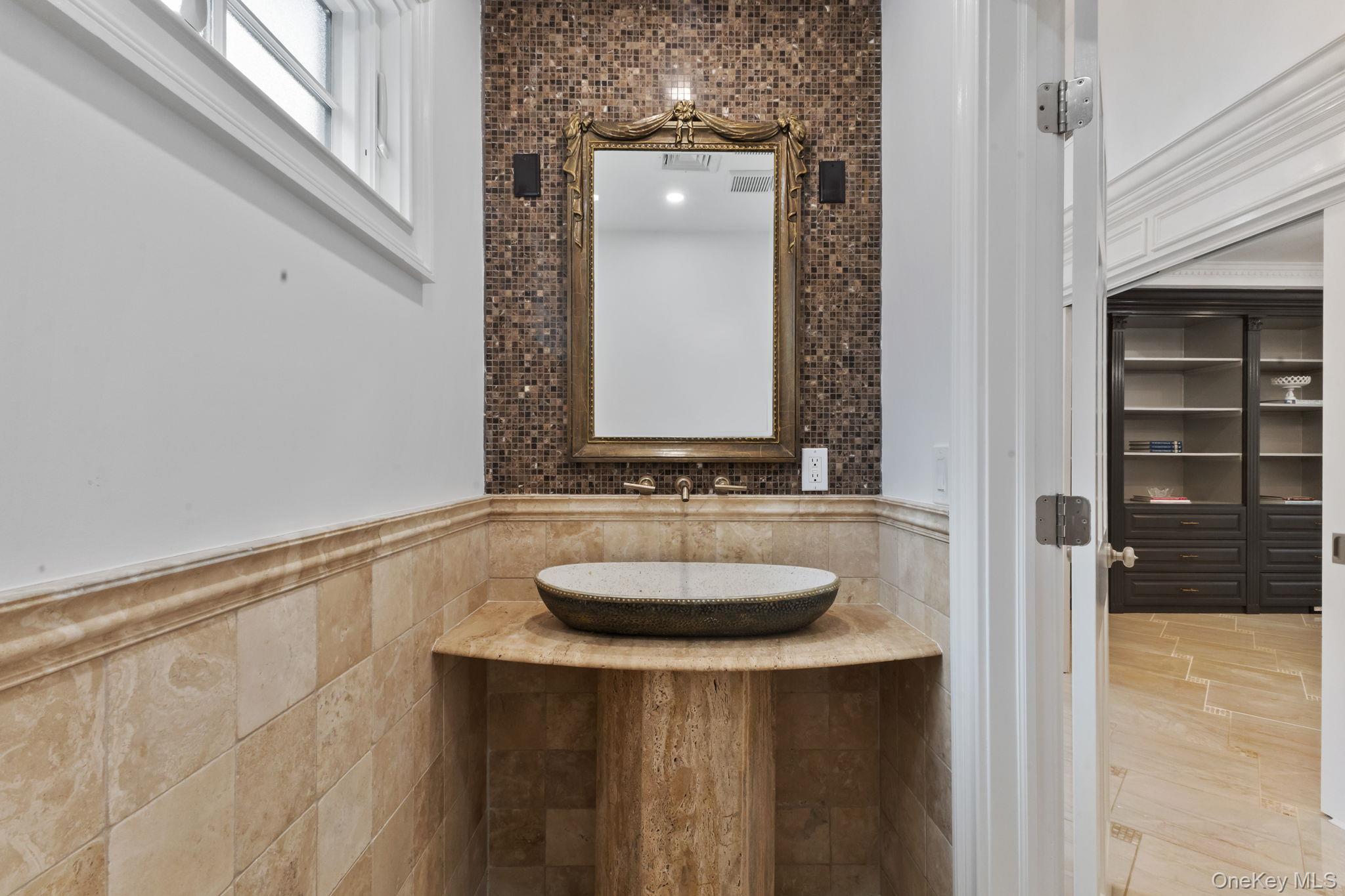 675 Quaker Road Chappaqua, NY 10514 - Photo 11 of 34 a bathroom with a sink and a mirror