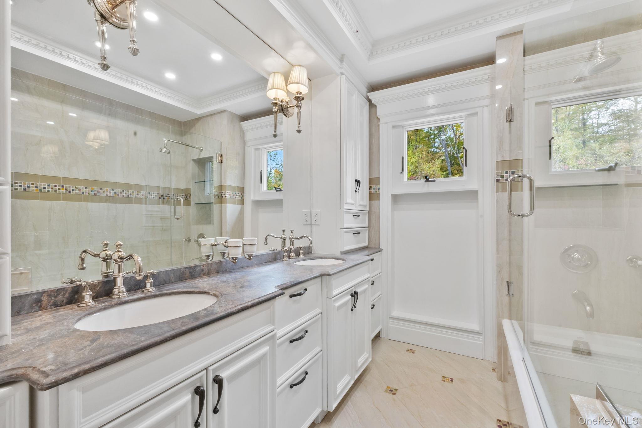 675 Quaker Road Chappaqua, NY 10514 - Photo 16 of 34 a bathroom with a granite countertop sink mirror and a bath tub