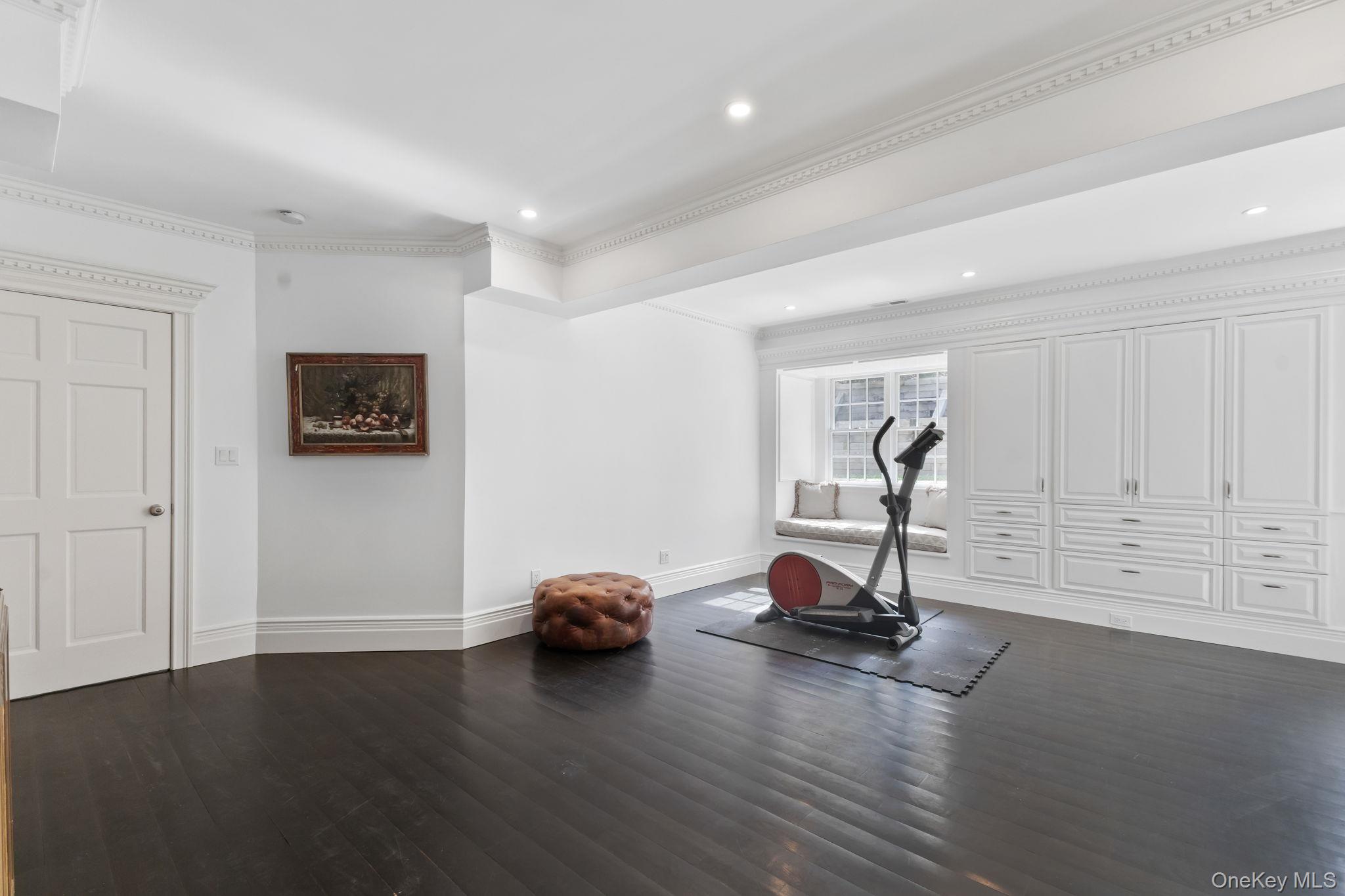 675 Quaker Road Chappaqua, NY 10514 - Photo 20 of 34 a view of a room with gym equipment