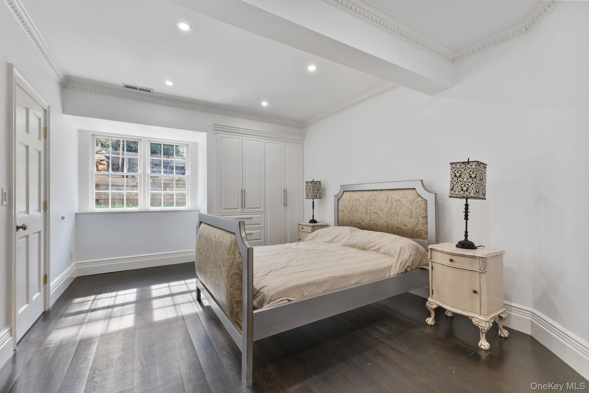 675 Quaker Road Chappaqua, NY 10514 - Photo 23 of 34 a bedroom with a bed and a window