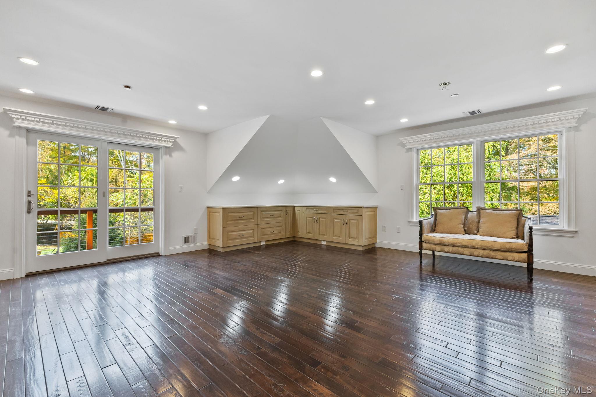 675 Quaker Road Chappaqua, NY 10514 - Photo 25 of 34 a view of empty room with wooden floor and fan