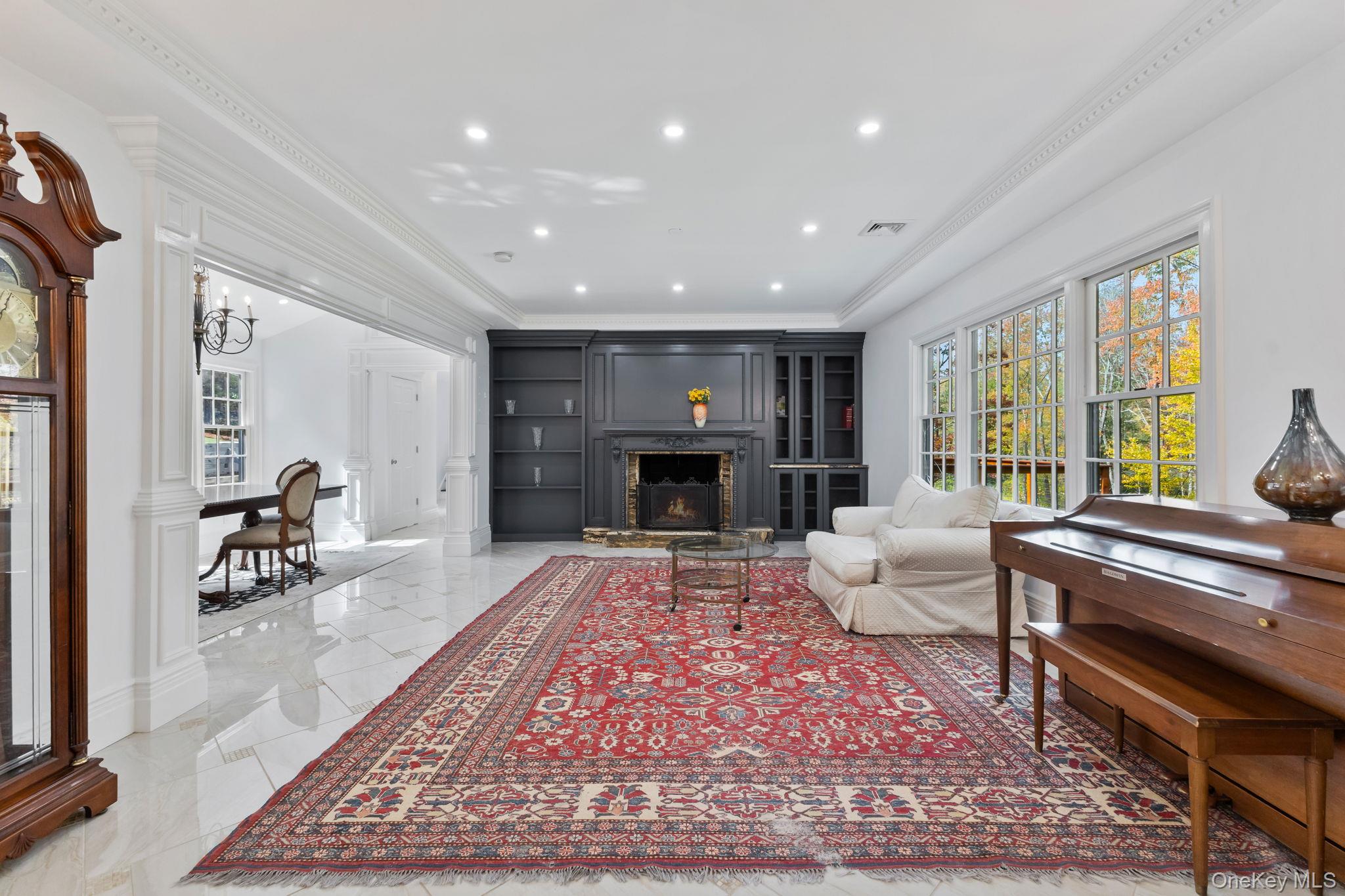 675 Quaker Road Chappaqua, NY 10514 - Photo 5 of 34 a living room with furniture and a fireplace