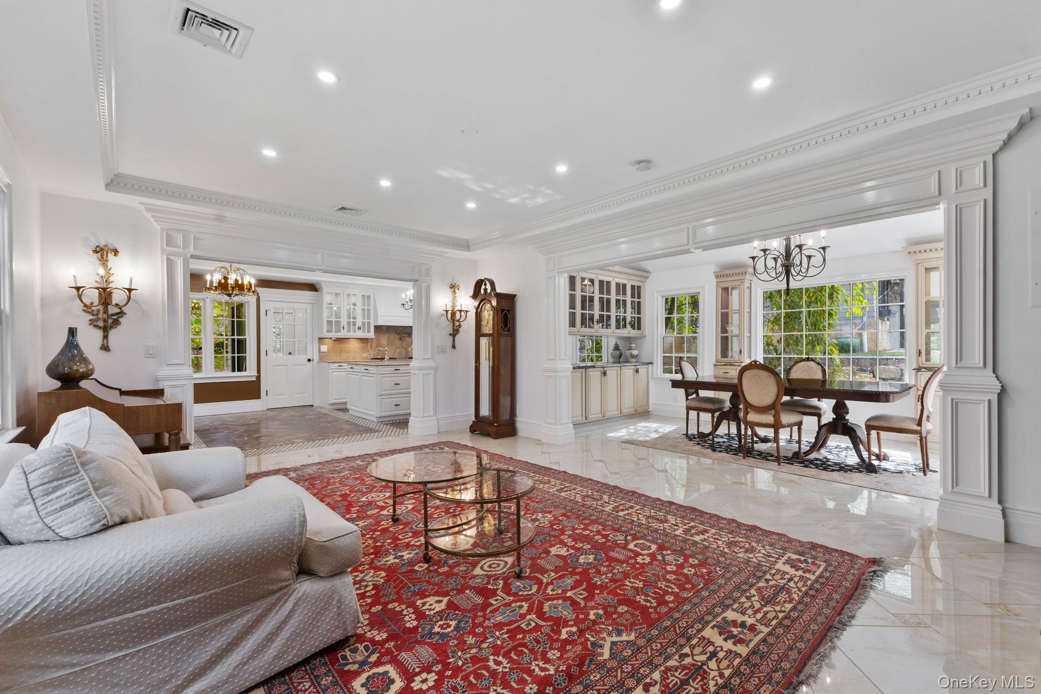 675 Quaker Road Chappaqua, NY 10514 - Photo 7 of 34 a living room with furniture and a large window