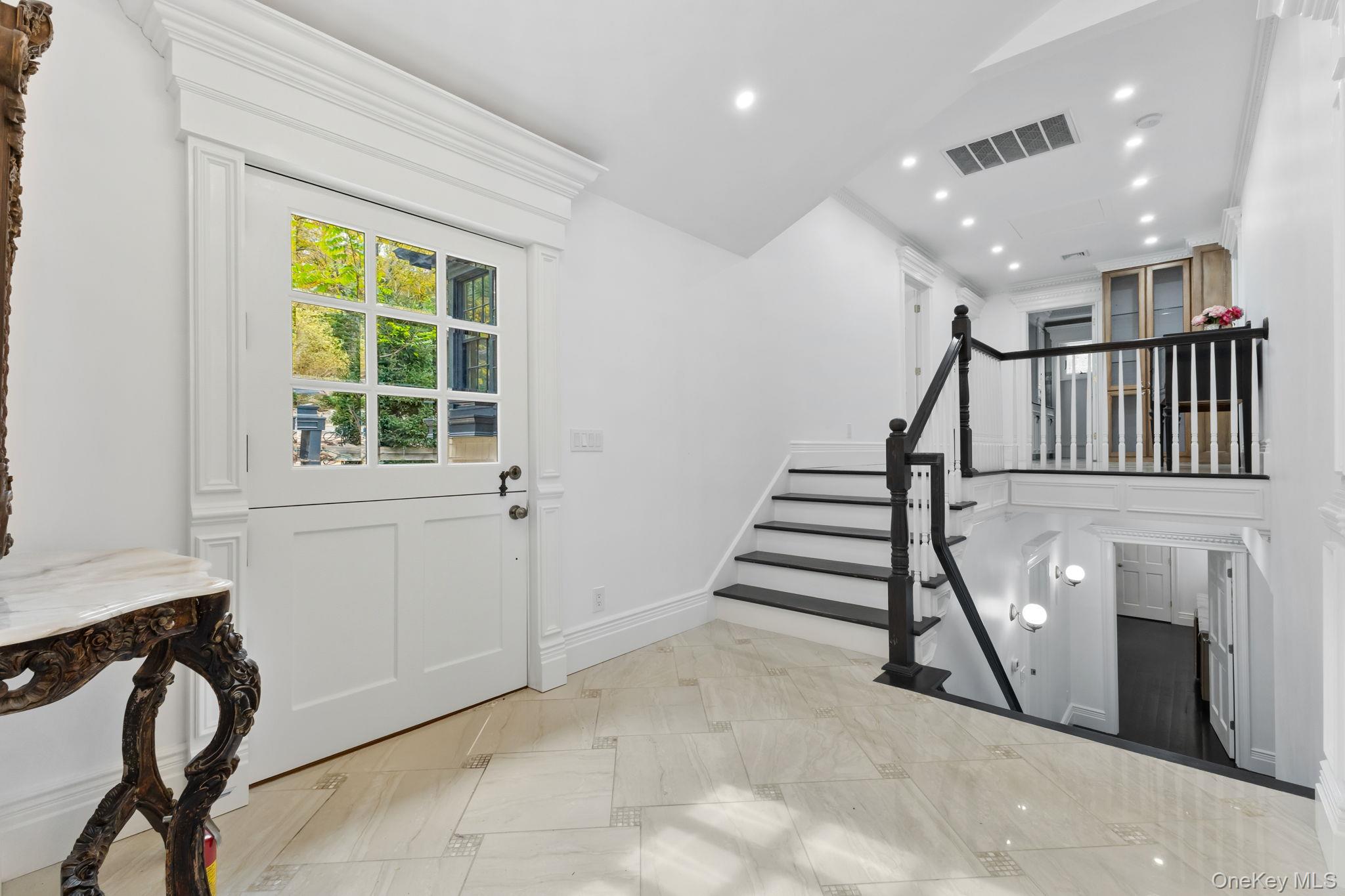 675 Quaker Road Chappaqua, NY 10514 - Photo 9 of 34 a view of entryway with stairs and furniture