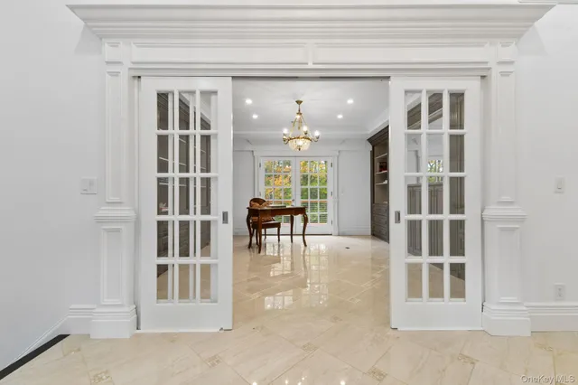 a view of a livingroom with furniture and staircase