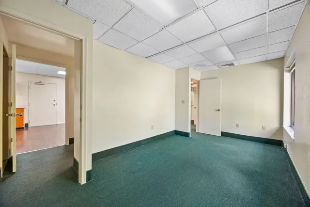 a view of a livingroom with furniture and a window