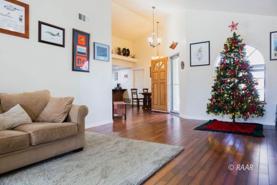 809 Charles Court Ridgecrest, CA 93555 - Photo 6 of 33 a living room with furniture and wooden floor