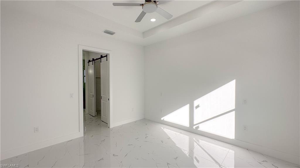 1028 19th Street Southwest Naples, FL 34117 - Photo 14 of 50 a view of a hallway with a window