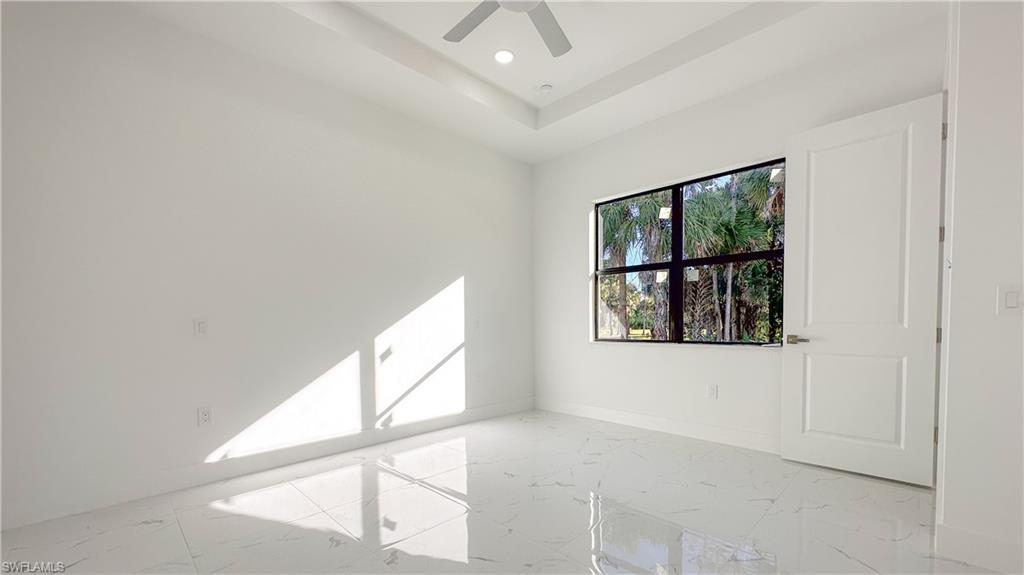 1028 19th Street Southwest Naples, FL 34117 - Photo 17 of 50 a view of an empty room and window