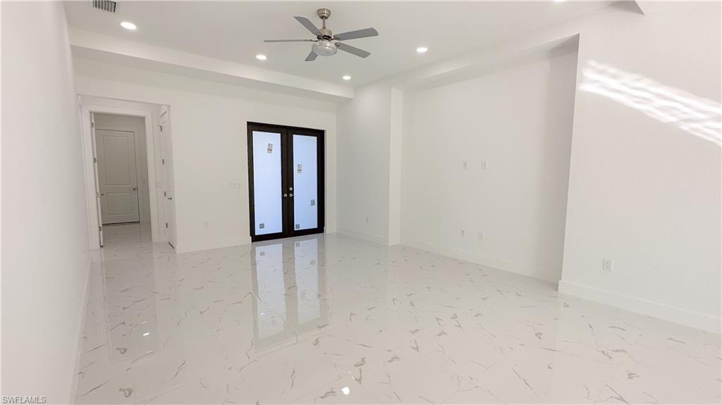 1028 19th Street Southwest Naples, FL 34117 - Photo 24 of 50 en empty room with windows and closet