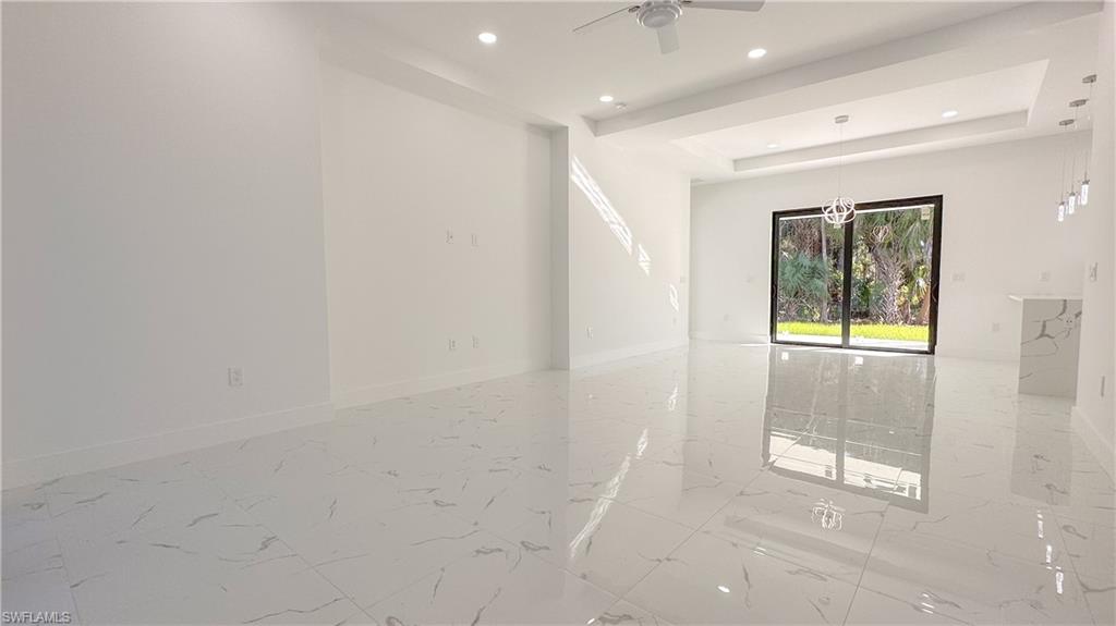 1028 19th Street Southwest Naples, FL 34117 - Photo 25 of 50 a view of an empty room with a window