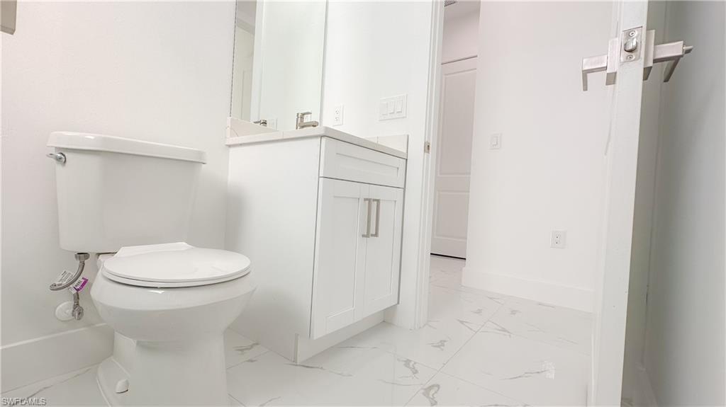 1028 19th Street Southwest Naples, FL 34117 - Photo 35 of 50 a bathroom with a toilet and a shower