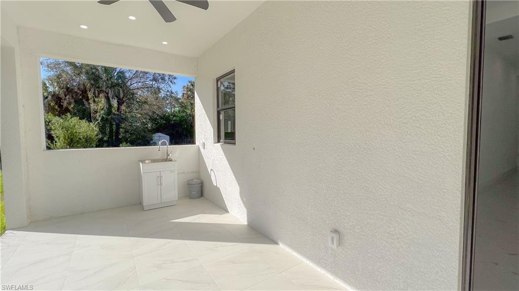 1028 19th Street Southwest Naples, FL 34117 - Photo 38 of 50 a view of a room with a tub and a window