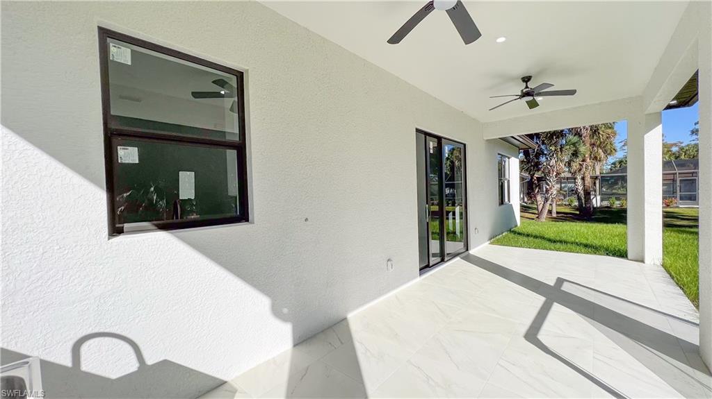 1028 19th Street Southwest Naples, FL 34117 - Photo 39 of 50 a bedroom with a bed and a large window