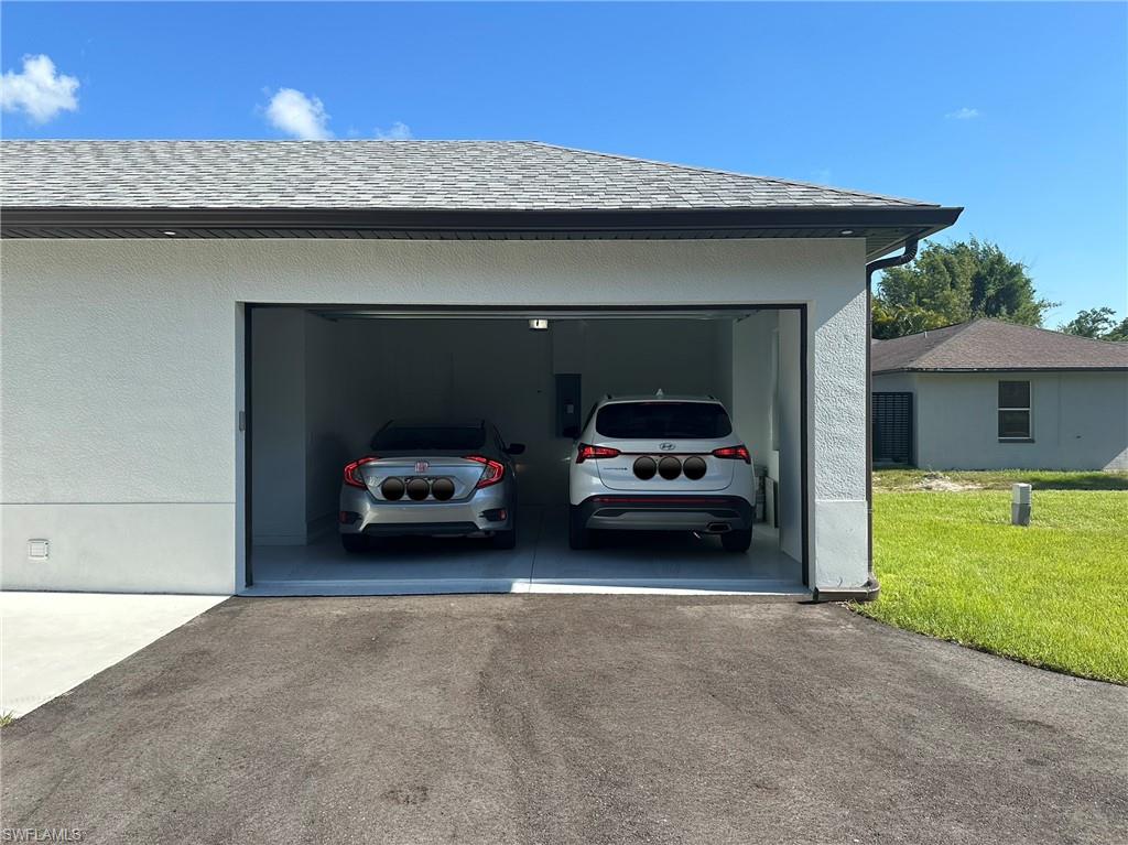 1028 19th Street Southwest Naples, FL 34117 - Photo 41 of 50 a car parked in front of a house