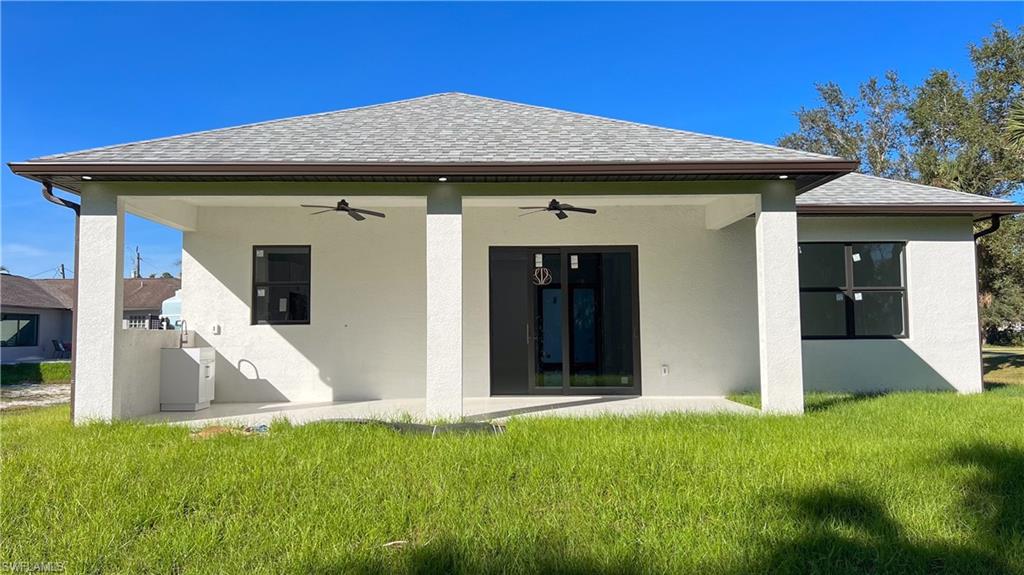 1028 19th Street Southwest Naples, FL 34117 - Photo 43 of 50 a view of a house with a yard
