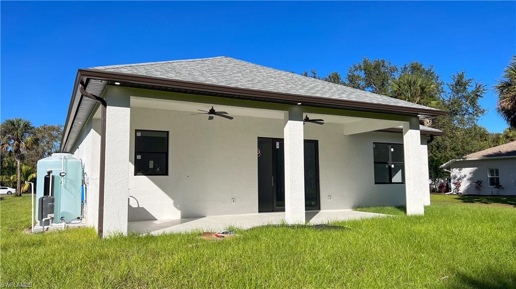1028 19th Street Southwest Naples, FL 34117 - Photo 44 of 50 a front view of a house with garden