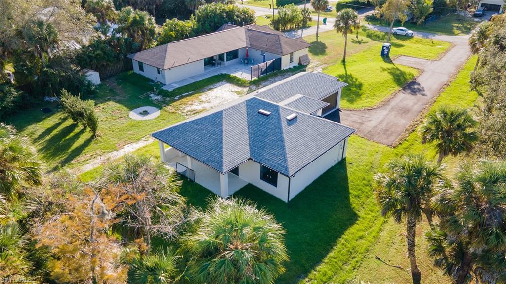 1028 19th Street Southwest Naples, FL 34117 - Photo 50 of 50 an aerial view of a house with a yard basket ball court and outdoor seating