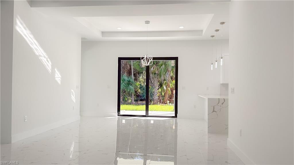 1028 19th Street Southwest Naples, FL 34117 - Photo 5 of 50 a bathroom with a window and a shower