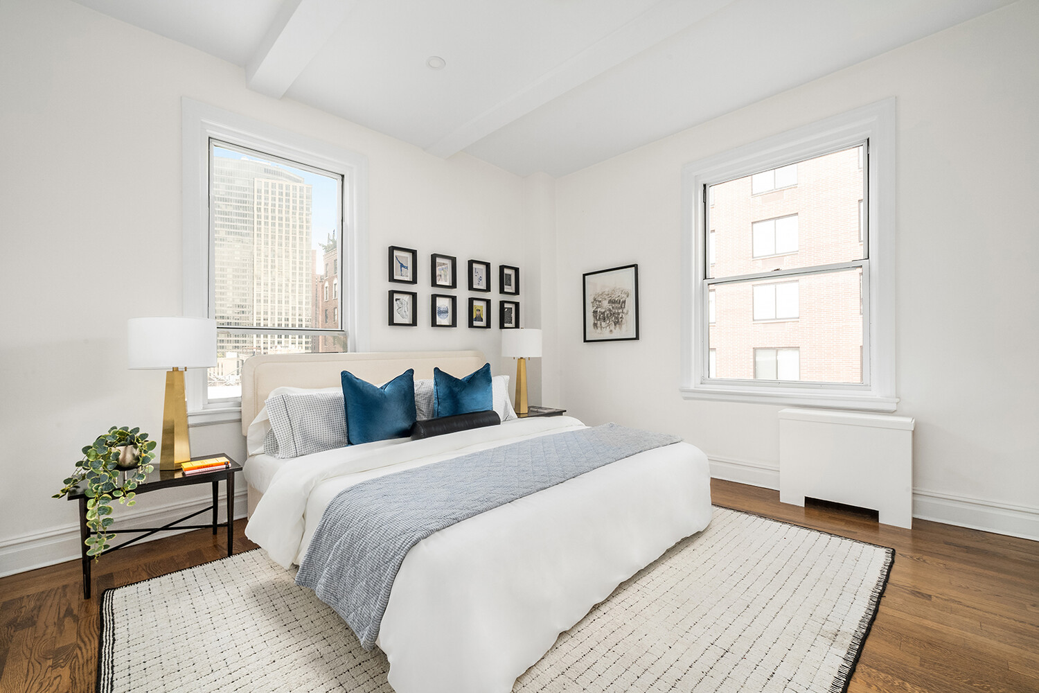 131 East 93rd Street, Unit 7A Manhattan, NY 10128 - Photo 5 of 8 a bedroom with a bed and a window