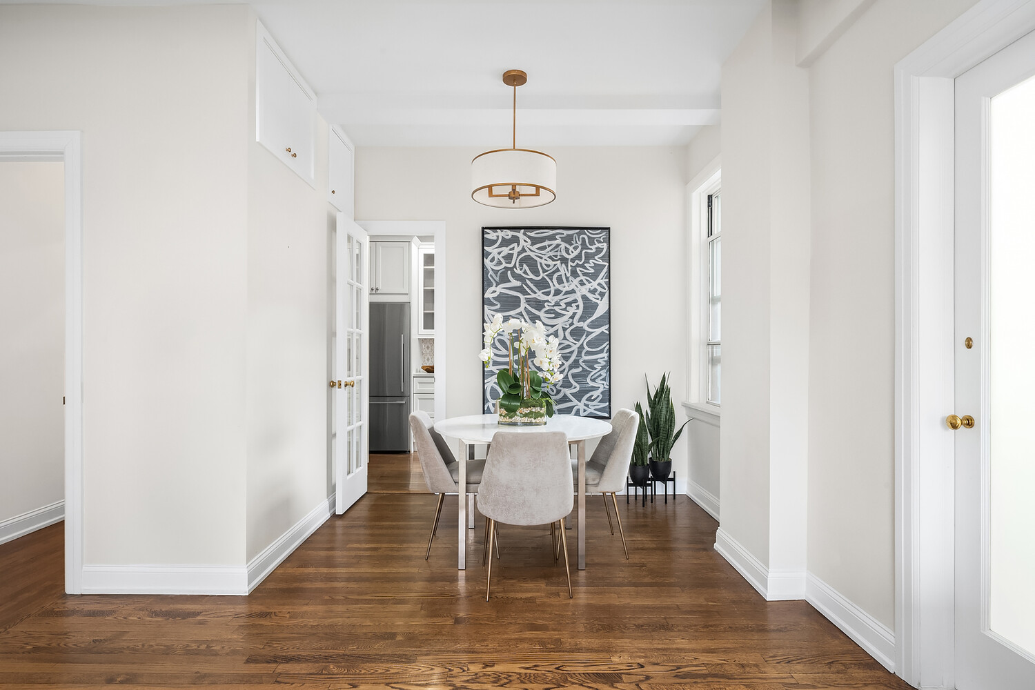 131 East 93rd Street, Unit 7A Manhattan, NY 10128 - Photo 6 of 8 a view of a dining room with furniture window and wooden floor