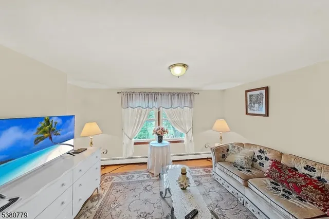 a living room with furniture and a table