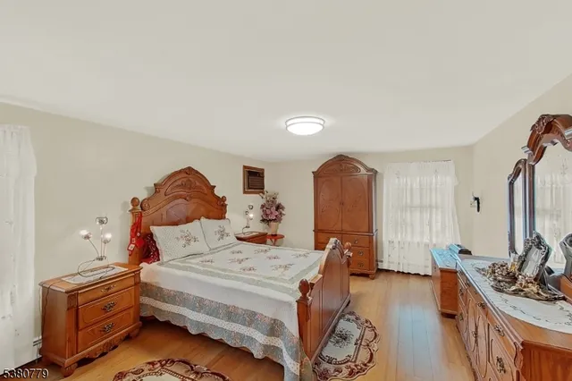 a bed room with a bed and a chair