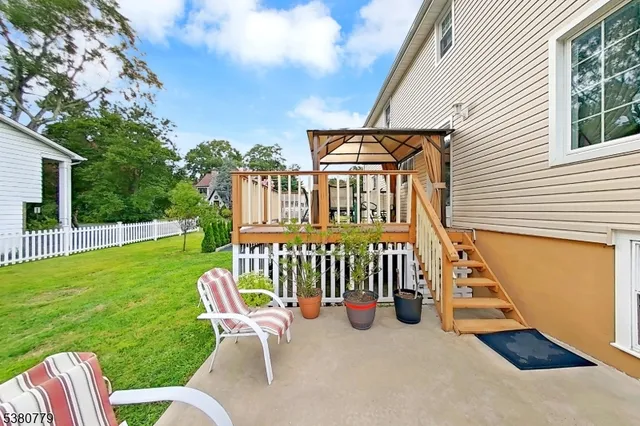 a view of a chair in the patio with a small yard