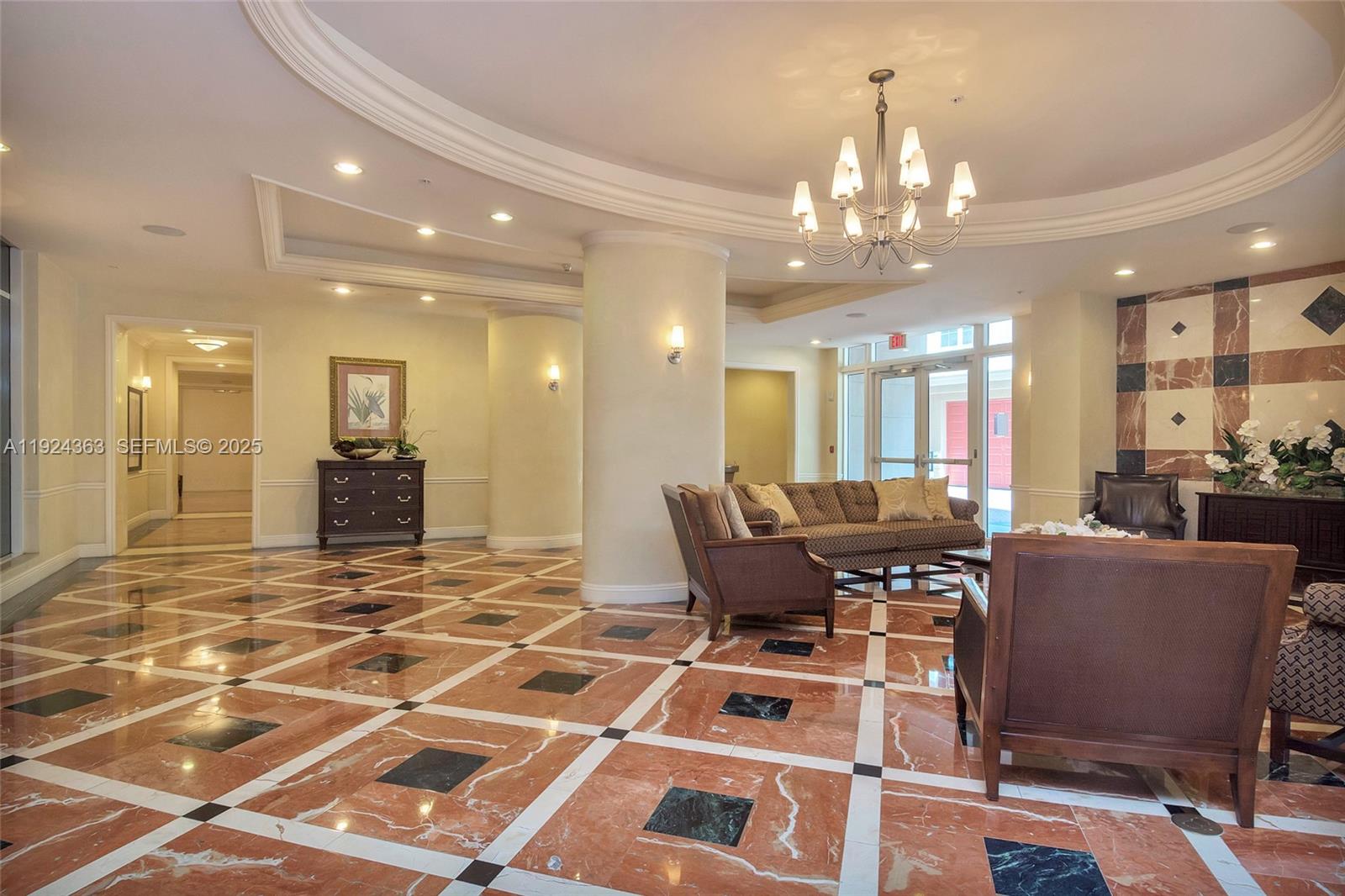 3232 Southwest 22nd Street, Unit 905 Miami, FL 33145 - Photo 18 of 24 a view of a dining room with furniture and a chandelier
